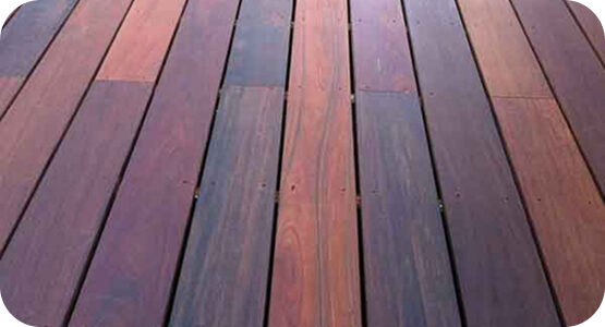 Tropical hardwood decking boards with rich dark wood tones