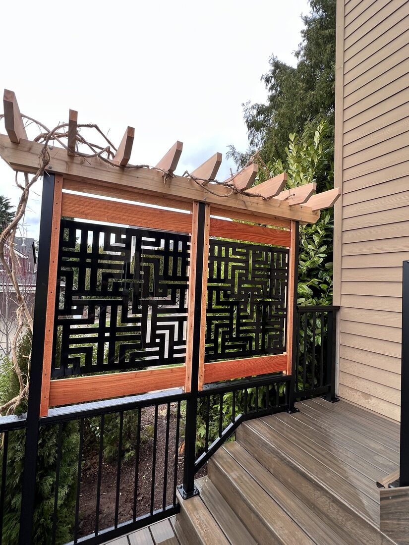 Custom decorative privacy screen with cedar pergola and aluminum railing
