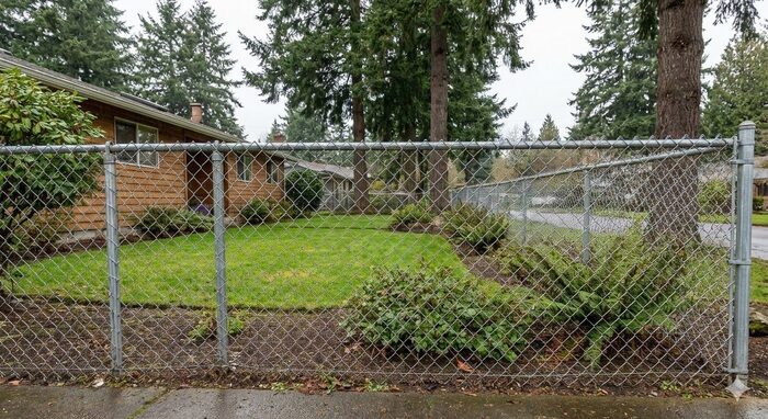 Residential chain link fence around front yard