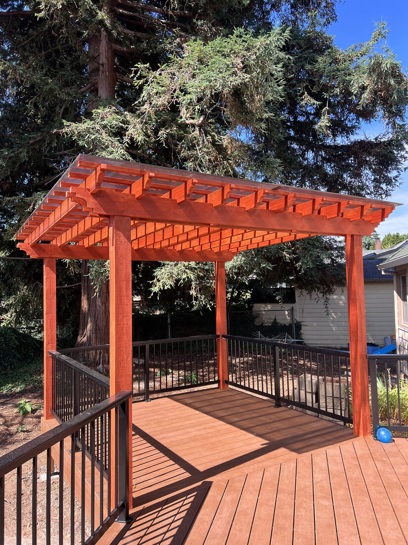 Custom wood pergola with aluminum deck railings