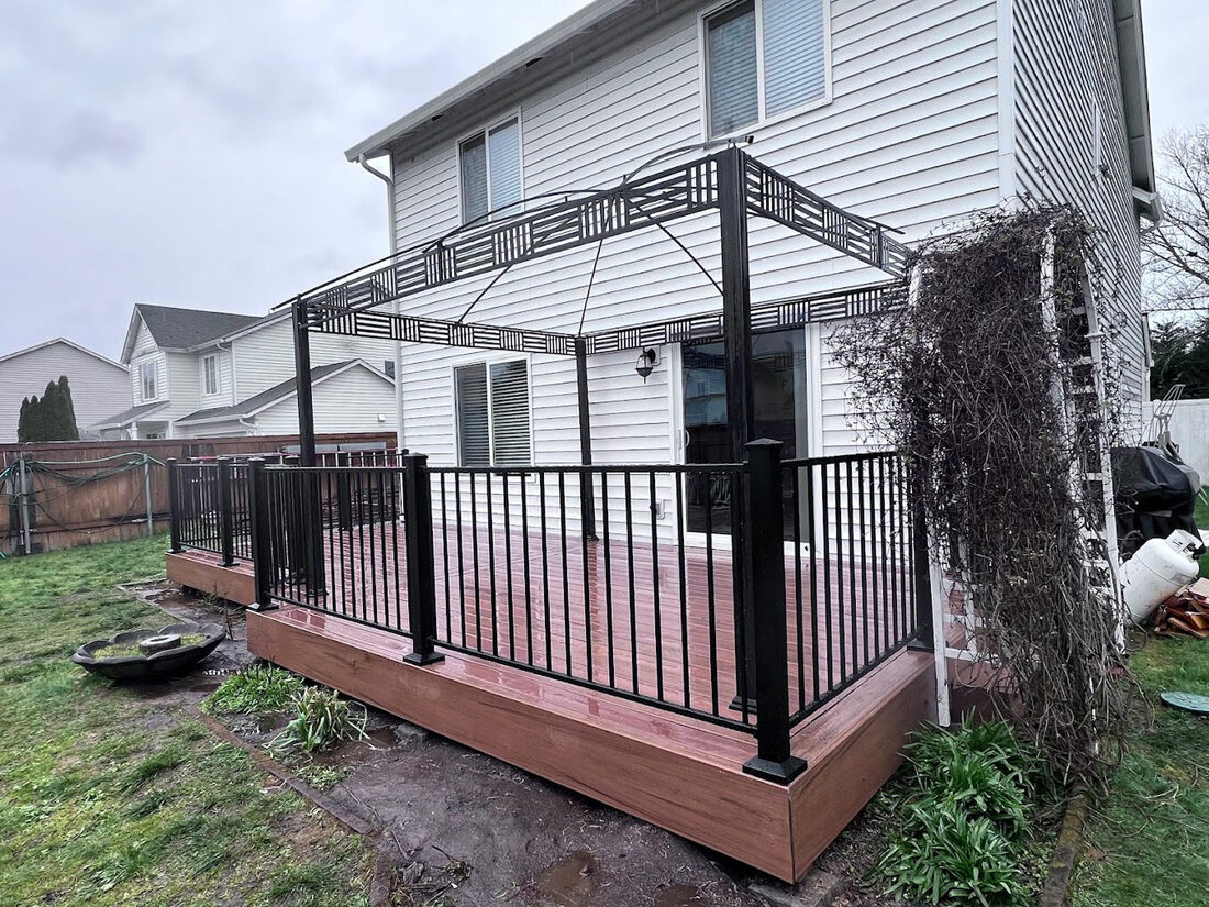 Custom pergola with railings on a backyard deck