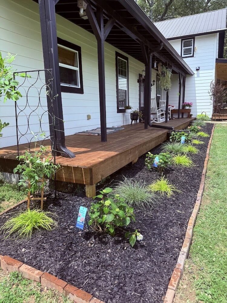 Covered farmhouse porch with wood decking