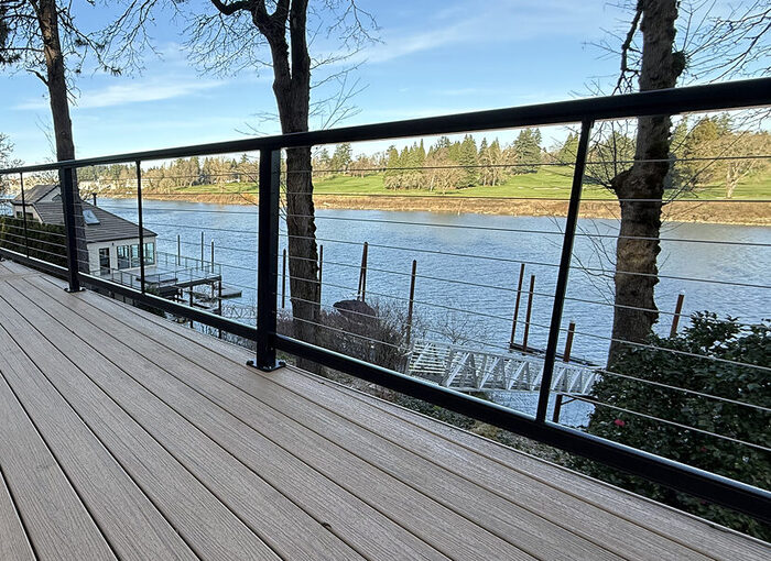 Modern cable deck railing overlooking the water