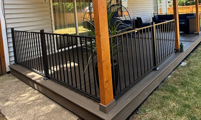 Composite deck with black metal picket railings