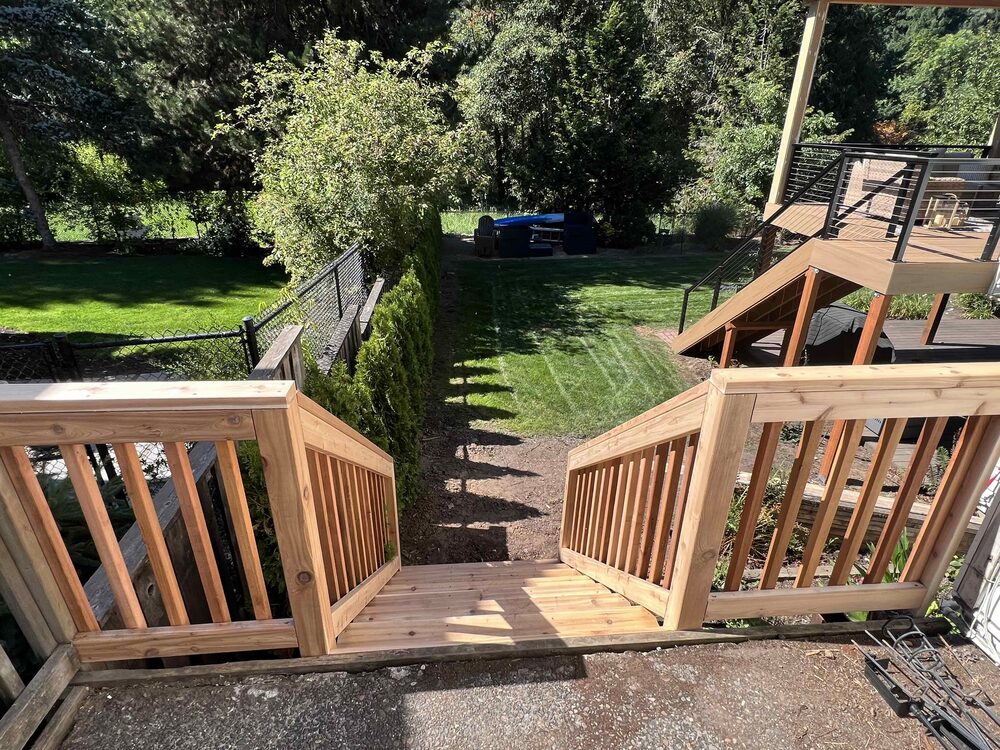 Cedar backyard deck stairs with wood railing