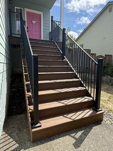 Wood porch stairs with aluminum railing and wide stair treads