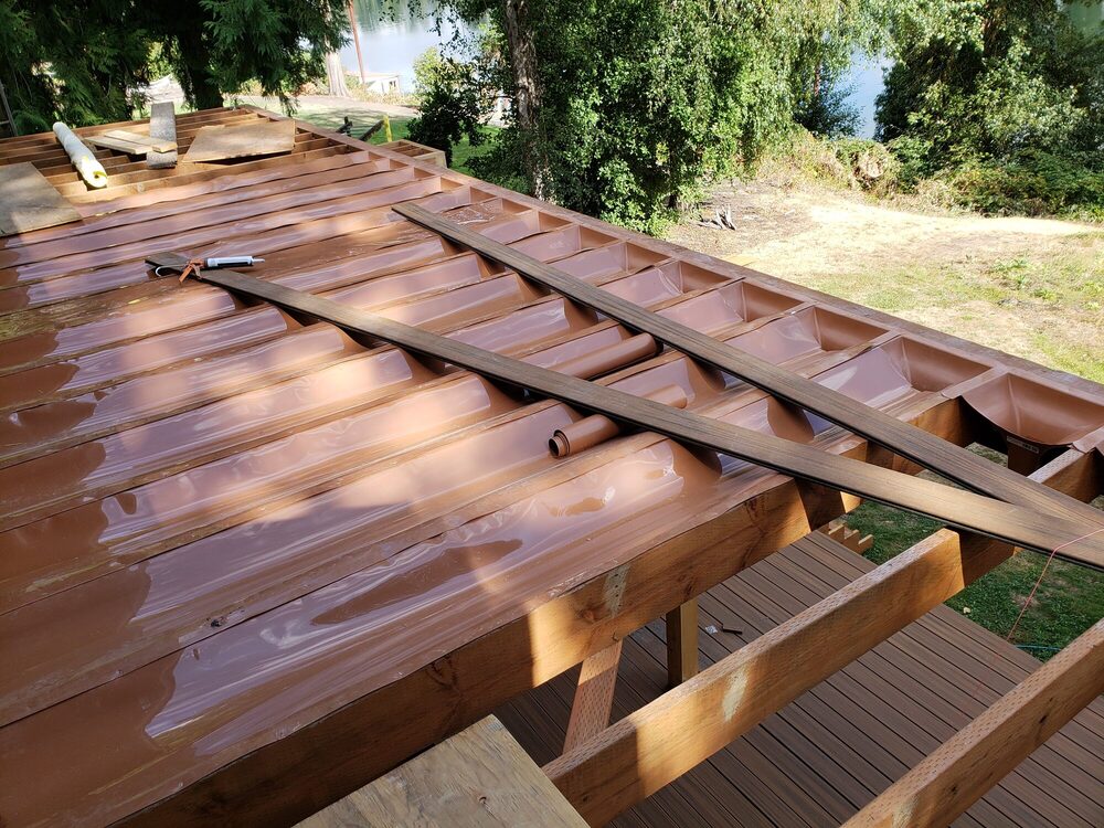 Reinforced waterproof deck coating system being installed on an elevated deck